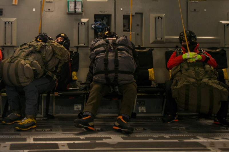 Illustration for article titled Check Out These Shots Of A C-17 Dropping Pararescuemen Over The Navy's Arctic OutpostÂ